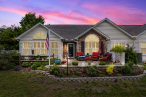Front exterior of 1167 Blue Bird Ln at sunset with manicured lawn